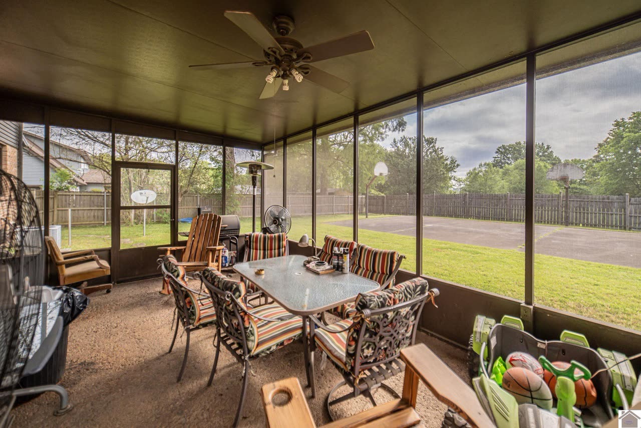 Screened-in back porch overlooking the basketball court